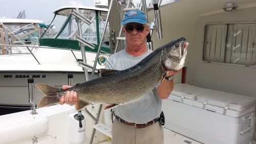 Denny Grinold with Lake Michigan Lake Trout.jpg